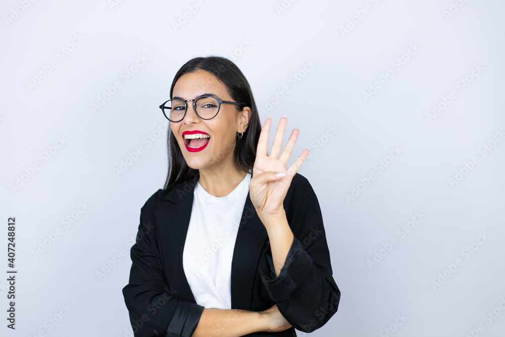 Beautiful business woman showing and pointing up with fingers number four while smiling confident and happy Beautiful business woman showing and pointing up with fingers number four while smiling confident and happy