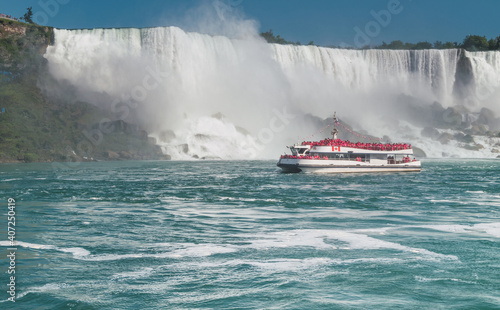 Tourist boat with Niagara Falls in the background