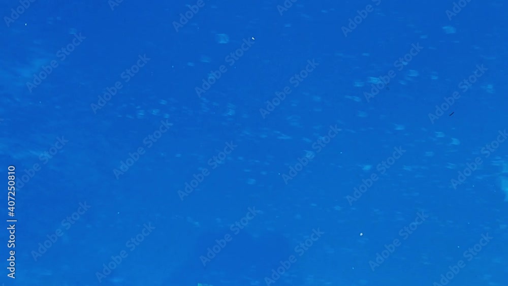 blue flowing water and bubbles through glass blue flowing water and bubbles through glass