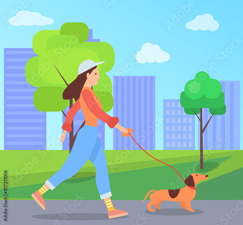 A girl with a dog is walking on the street. Female character spends time outdoors with her pet. The owner walks with cheerful puppy on a leash in open area against the background of cityscape