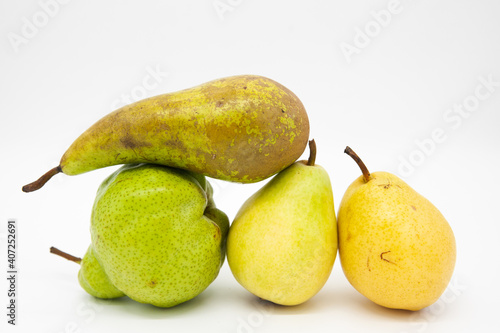 pear laying on top of other pears