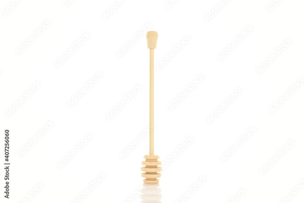 One wooden spoon, for honey, close-up, isolated on white. One wooden spoon, for honey, close-up, isolated on white.