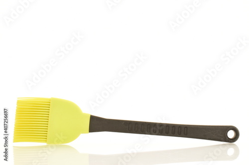 One silicone kitchen brush  close up  isolated on white.