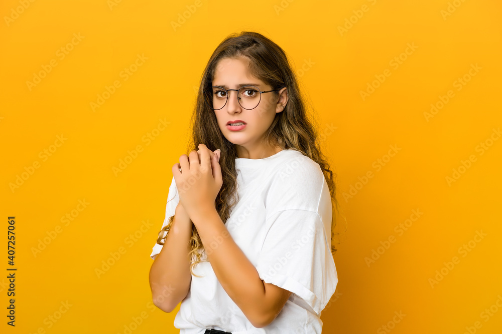 Young caucasian woman scared and afraid. Young caucasian woman scared and afraid.