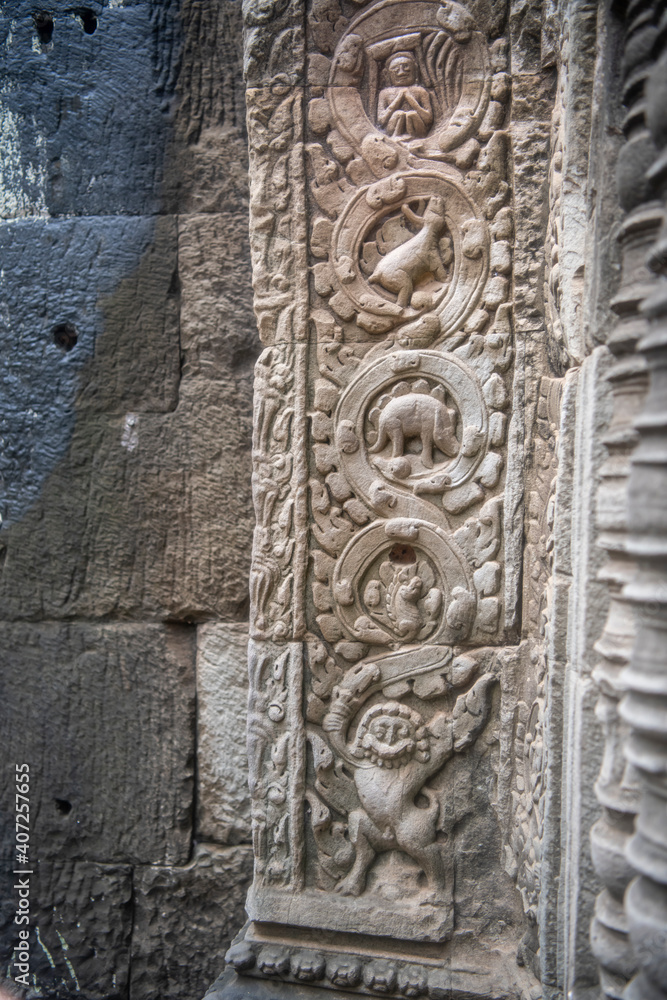 Та Prohm is the temple, it rains in the rainy season.The preserved symbiosis of stone and wood allows us to see Ta Prohm in this form.Bas-relief.(Cambodia, 04.10. 2019). Та Prohm is the temple, it rains in the rainy season.The preserved symbiosis of stone and wood allows us to see Ta Prohm in this form.Bas-relief.(Cambodia, 04.10. 2019).