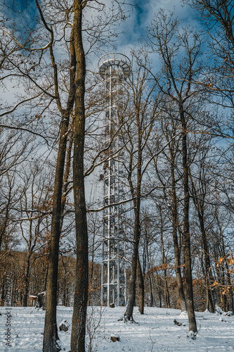 Lookout tower Brno in forest. View from viewpoint Brno Holedna. Jundrov viewpoint. Steel watchtower. photo