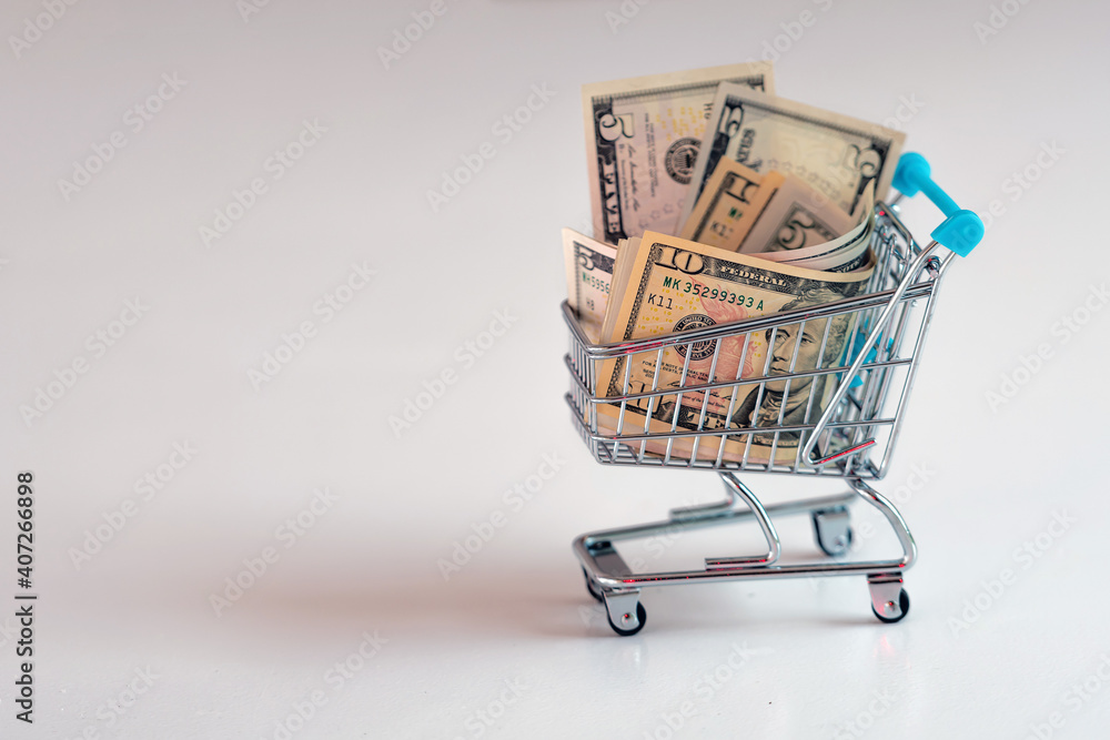 shopping cart full of money, business, finance, economy concept