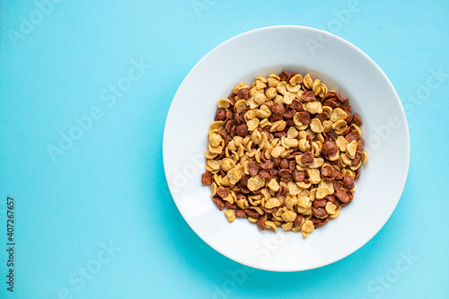 cornflakes breakfast on a plate ready to eat on the table for healthy meal snack outdoor top view copy space for text food background image