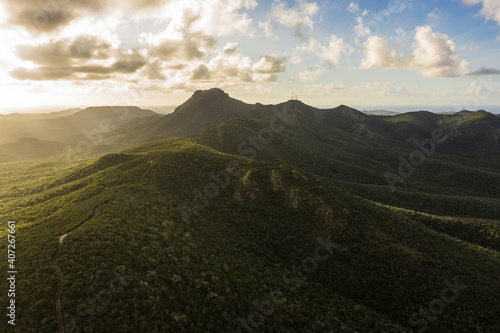 Aerial view above scenery of Curacao, Caribbean with ocean, coast, hills, lake photo