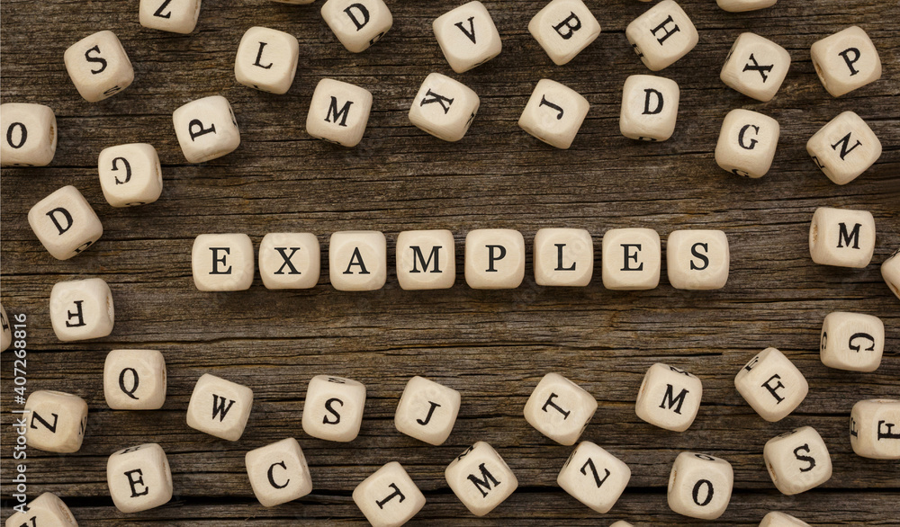 Word EXAMPLES written on wood block Word EXAMPLES written on wood block