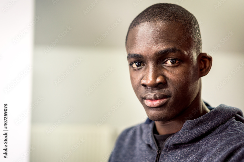 Obraz premium Portrait of young Afro-American man indoors