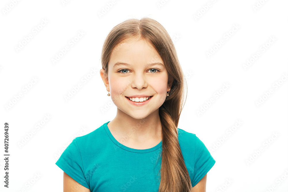 Portrait of a beautiful caucasian girl with a white healthy smile, isolated on white background. Child's toothy smile Portrait of a beautiful caucasian girl with a white healthy smile, isolated on white background. Child's toothy smile