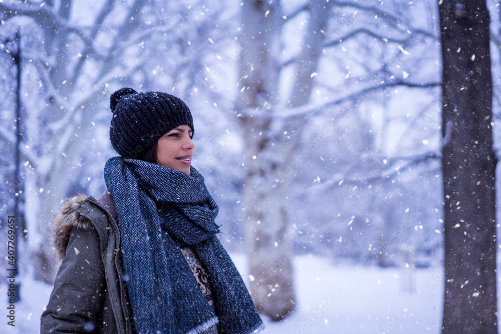 Beautiful happy female in the winter walk outdoors with a lot of snow Beautiful happy female in the winter walk outdoors with a lot of snow