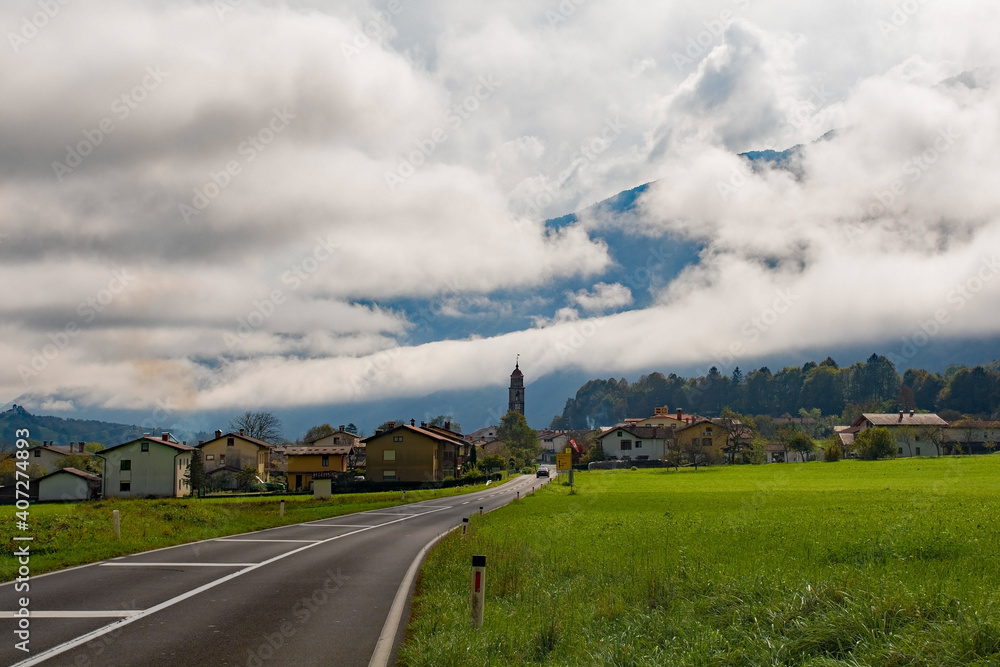 Autumnal low morning clouds over village of Idrsko near Kobarid in the Slovene Littoral or Primorska region of western Slovenia. The foothills of the Julian Alps can be seen in the background
