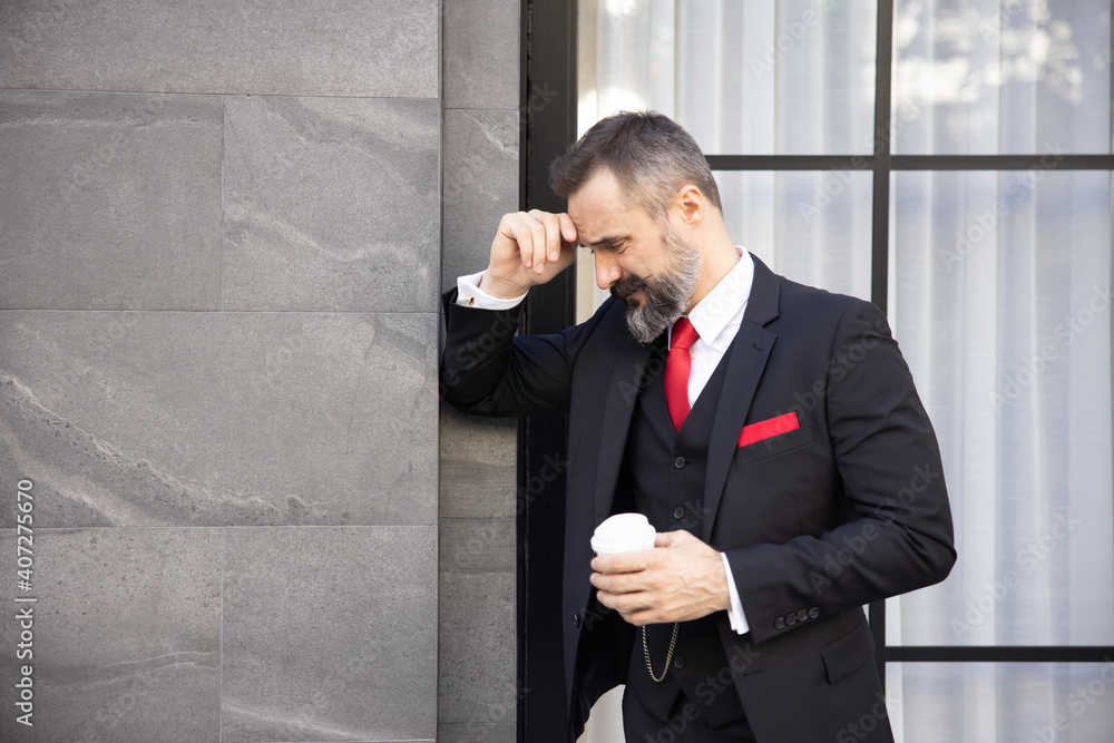 Businessman in Suit Holding a Cup of Coffee with Depression Businessman in Suit Holding a Cup of Coffee with Depression