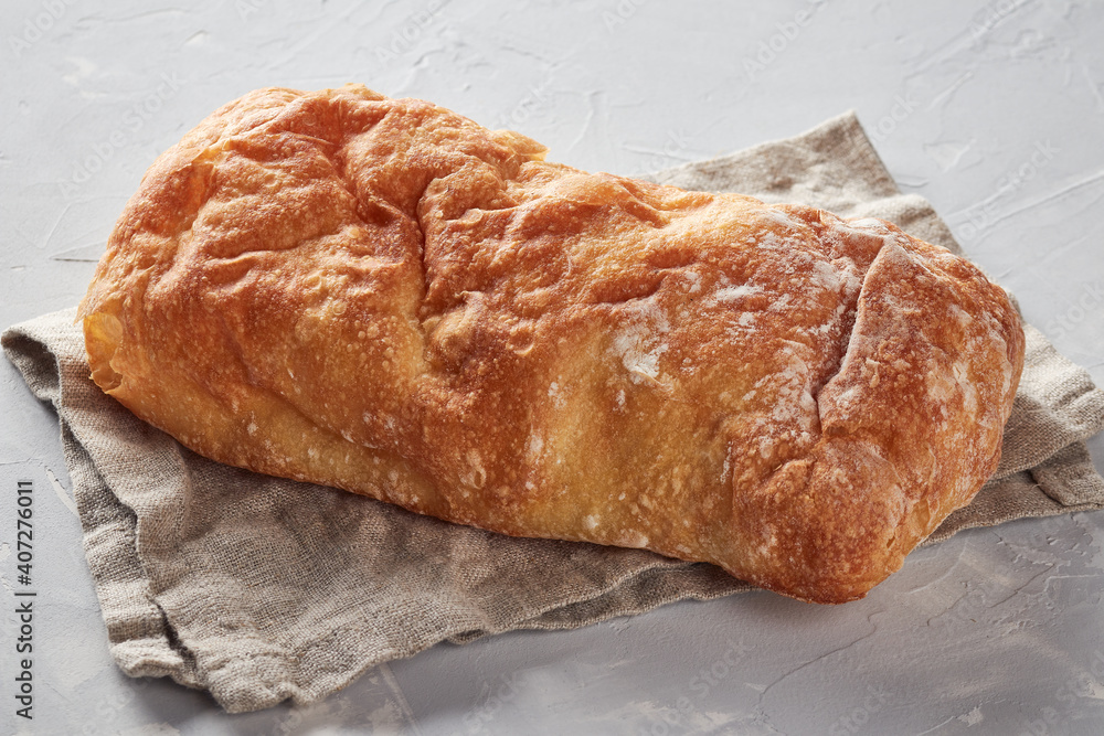 White bread made from wheat flour, concrete background White bread made from wheat flour, concrete background