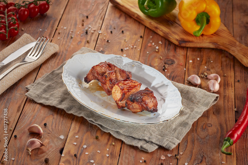 Grilled pork BBQ, wooden background