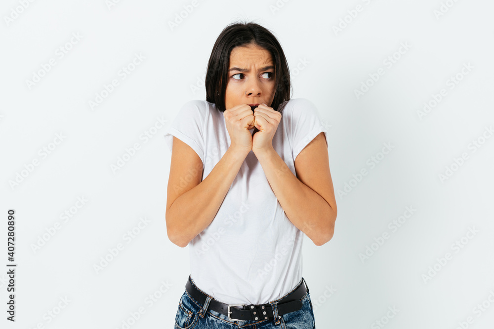 Scared woman in t-shirt and jeans Scared woman in t-shirt and jeans