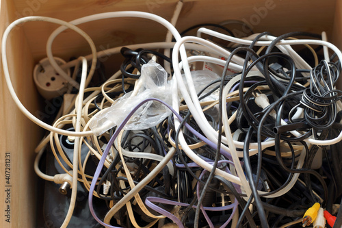 Matassa di fili elettrici ingarbugliati tra loro, difficile da rimettere in ordine.. photo