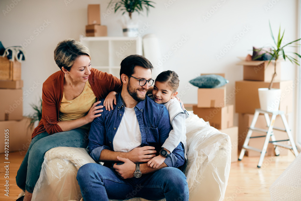 Loving family relaxing in the living room of their new home. Loving family relaxing in the living room of their new home.