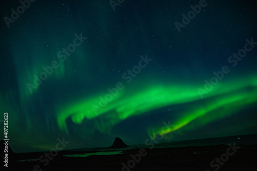 Fototapeta Naklejka Na Ścianę i Meble -  strong northern lights (aurora borealis) in the norwegian wilderness