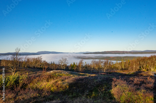 Fog over a valley of Lierne national park in Norway