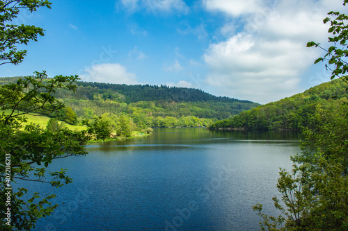Rursee at Eifel National Park  Germany. Scenic view of lake Rursee and surrounded green hills in North Rhine-Westphalia