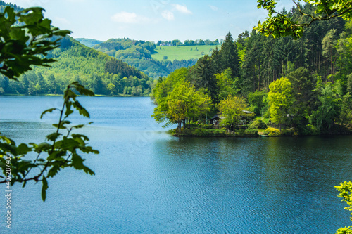 Rursee at Eifel National Park, Germany. Scenic view of lake Rursee and surrounded lush green landscape in North Rhine-Westphalia