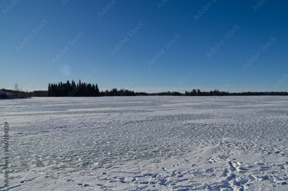 Astotin Lake Frozen on a Sunny Winter Day Astotin Lake Frozen on a Sunny Winter Day