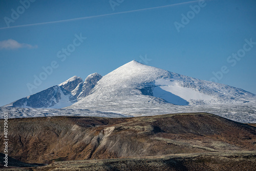 Mountain Snøhetta covered in snow in Norway
