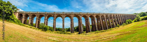 A panorama view from a field beside the Ouse Valley viaduct in Sussex  UK on a summers day
