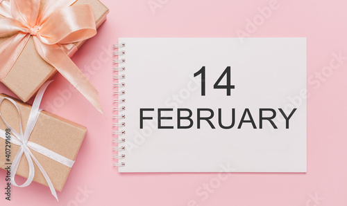 Gifts with note letter on isolated pink background, love and valentine concept with text 14 february