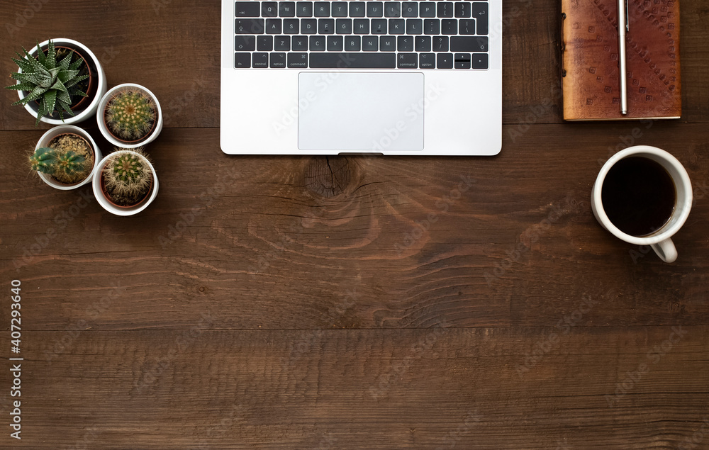 .Laptop, coffee, pen and notebook on old wooden table with copy space. .Laptop, coffee, pen and notebook on old wooden table with copy space.