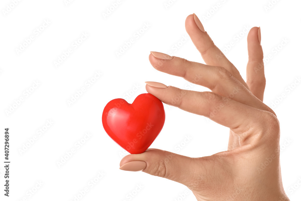 Hand with red heart on white background