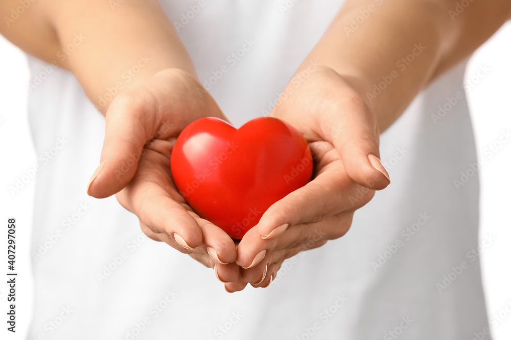 Woman with red heart, closeup Woman with red heart, closeup