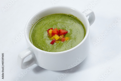 green cream soup on white background