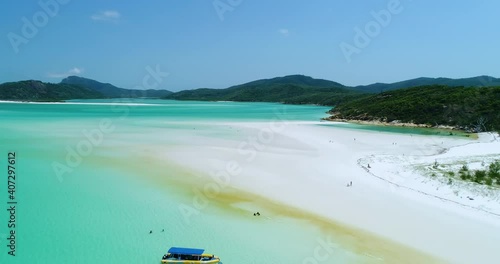 4K aerial forward tracking and panning motion of the white beach of Hill Inlet at Whitehaven beach,Whitsunday Islands,Queensland,Australia