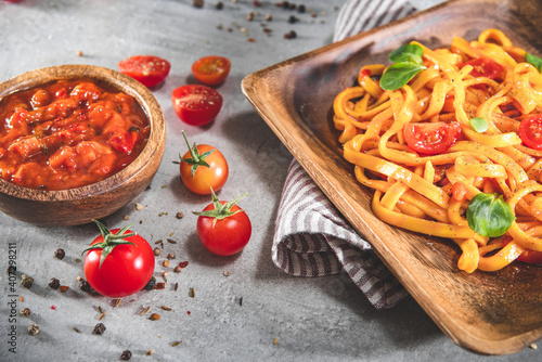 Pasta with tomato sauce and basil. Delicious tagliatelle. Italian tasty food
