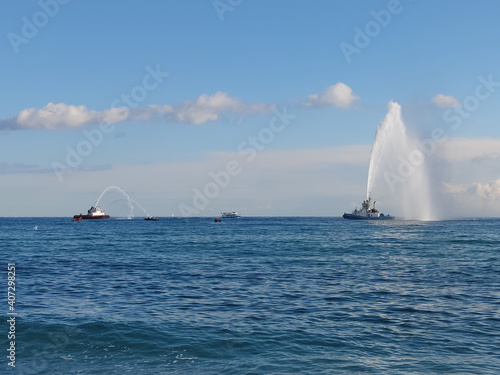 Fire Fighters Boat Spraying Water 