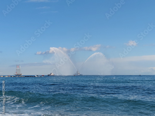 Fire Fighters Boat Spraying Water

