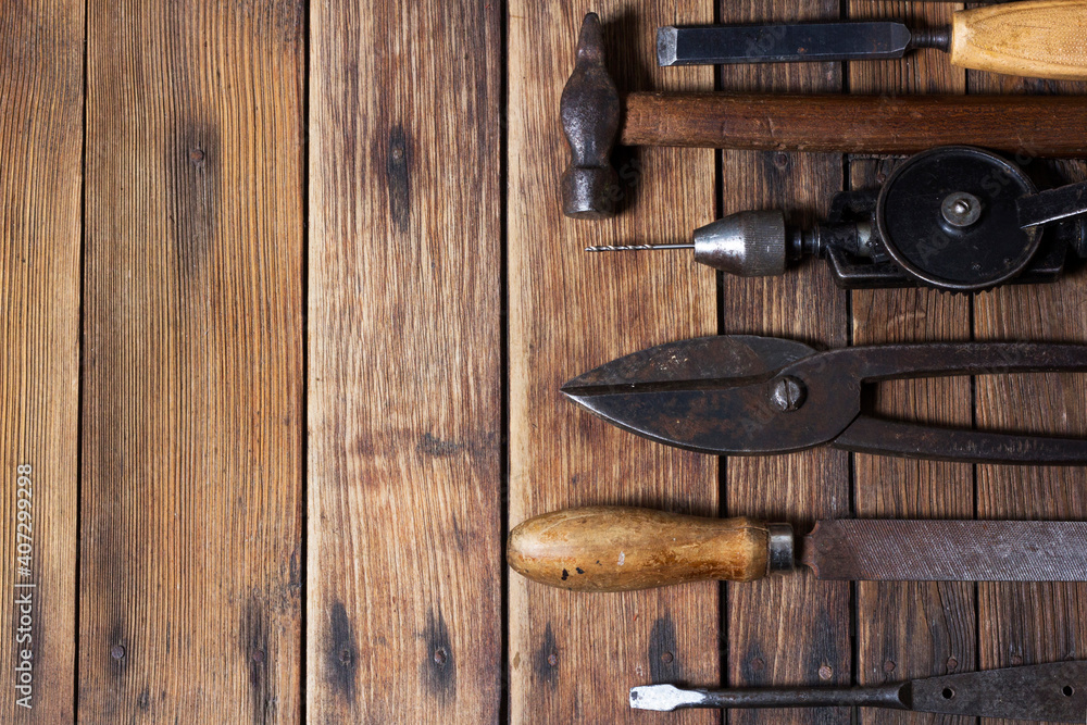 Fototapeta premium Old working tools. Vintage working tools on wooden background