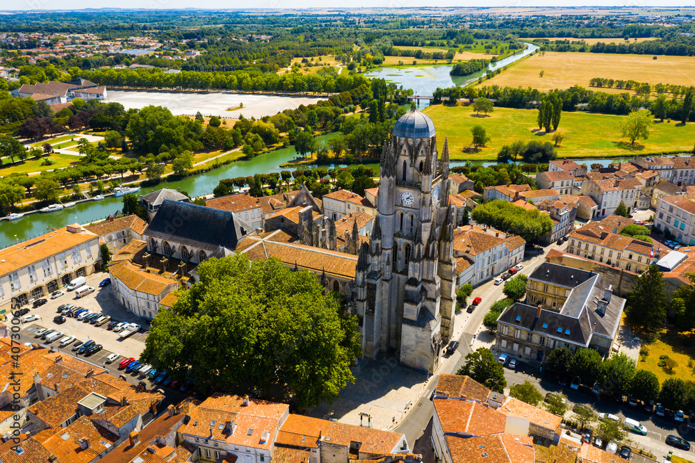 Scenic view from drone of historic district of Saintes town overlooking Flamboyant Gothic cathedral of St. Peter in summer, France