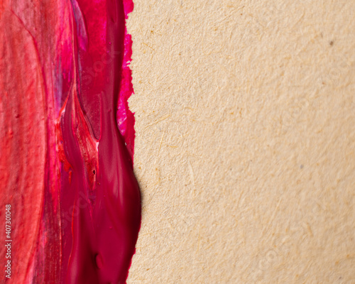 Close up Texture Red color paint on an old yellowed paper. Brush marks stroke for paper graphic design on background. Copy space for text.