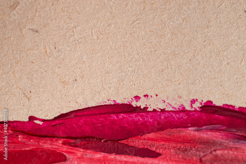 Close up Texture Red color paint on an old yellowed paper. Brush marks stroke for paper graphic design on background. Copy space for text.
