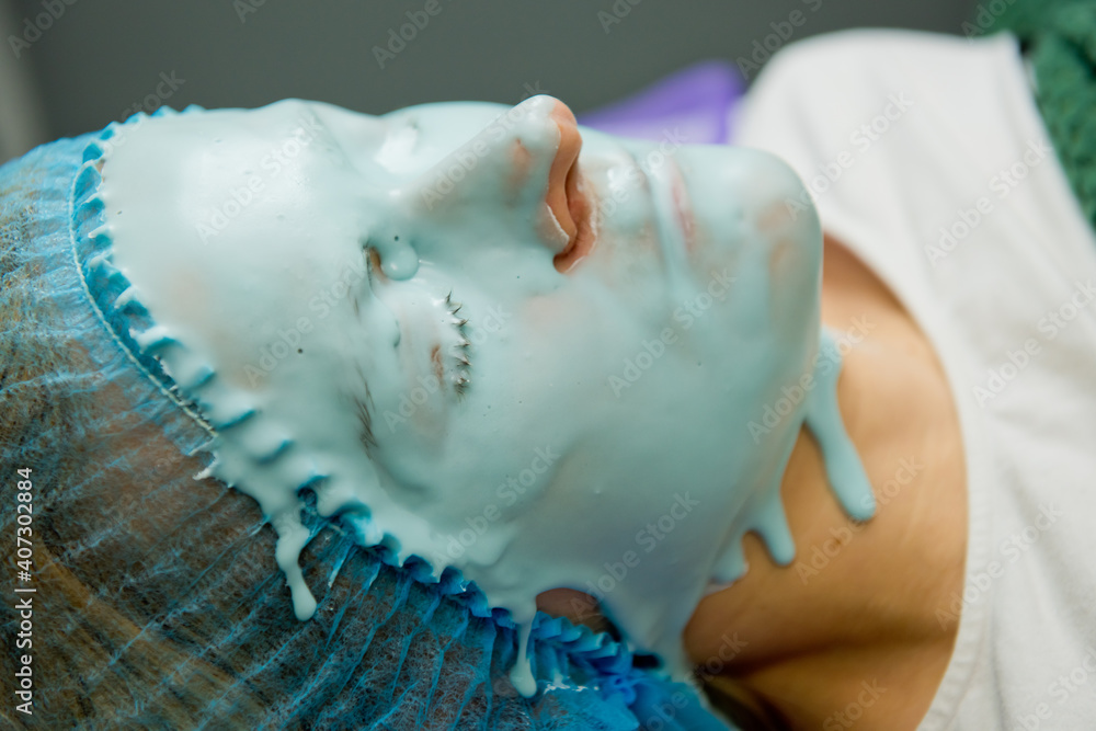 Alginate mask on face of woman. Close-up.