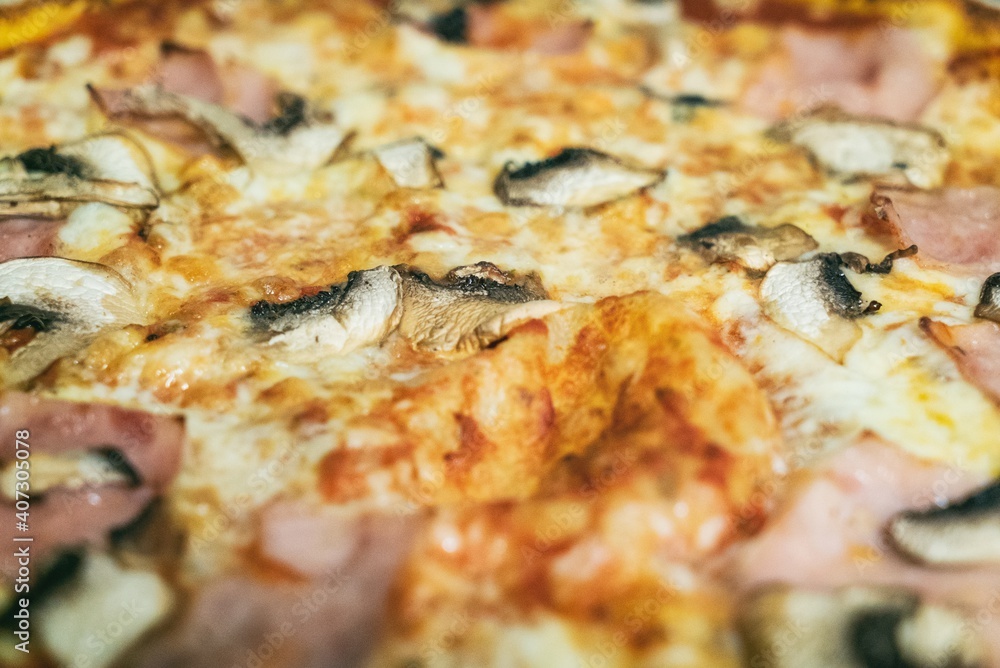Pizza from the oven. Oven-baked pizza with ham mushroom Pizza from the oven. Oven-baked pizza with ham mushroom