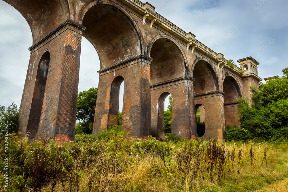 The view of the northern end of the Ouse Valley viaduct in Sussex, UK on a summers day