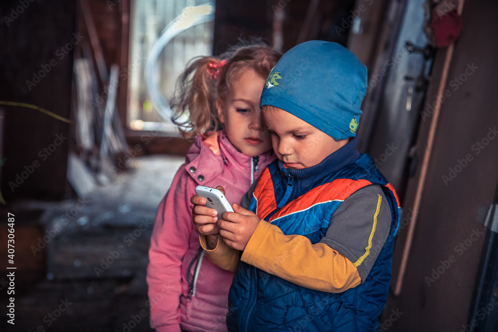Boy and girl looking on smartphone concept children friendship