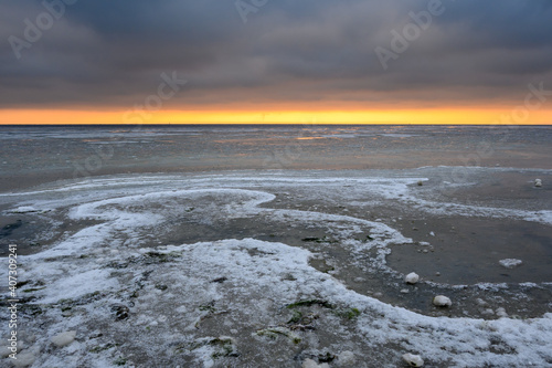 Winter landscape on the Baltic Sea. Frozen water on the beach in Jastarnia. Hel Peninsula. Poland
