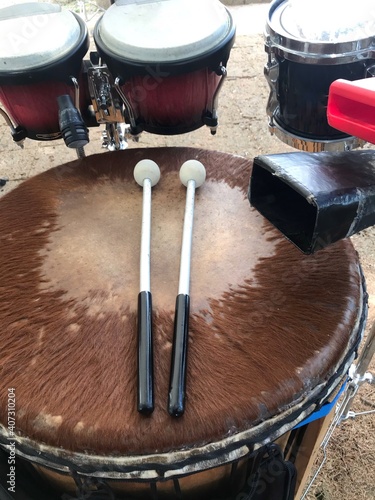 djembe drum with bongos and a cowbell